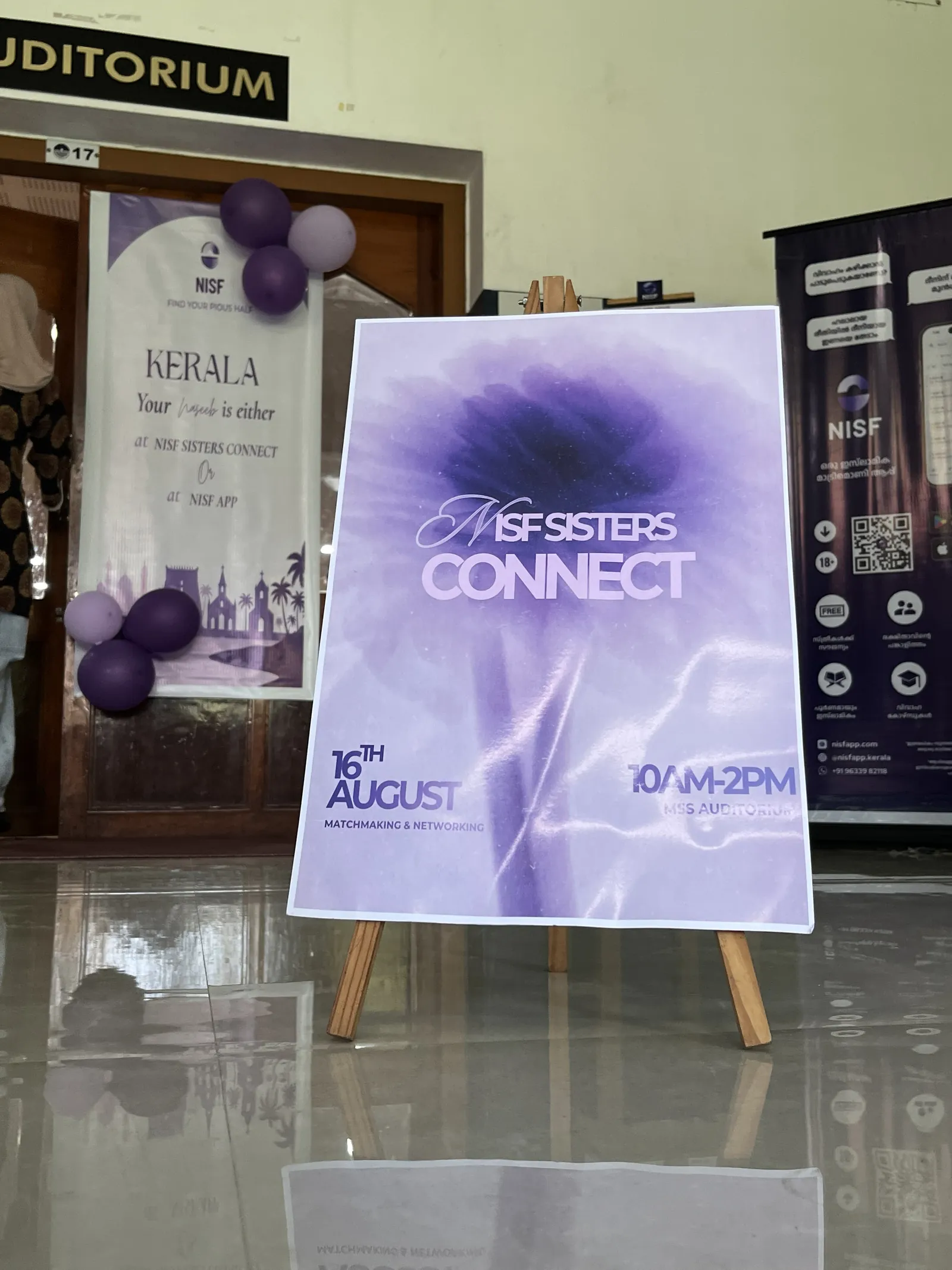 The Sisters Connect 26 signage, ready at the door.